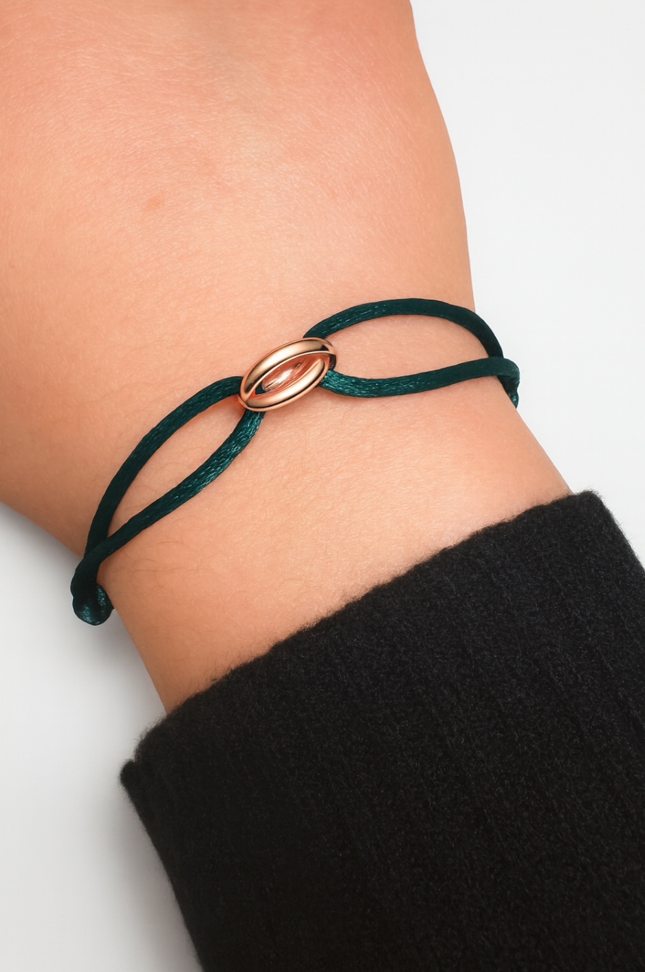 Cotton bracelet with genuine rose gold rings — close-up detail